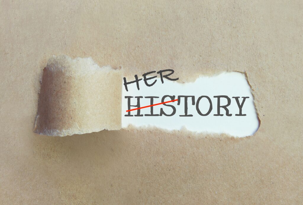 Torn brown paper revealing the word history